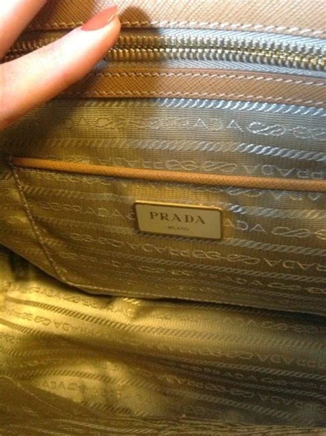 my other bags are prada|prada bag inside lining repairs.